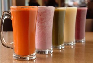 Homemade juicies with a selection of fruits.